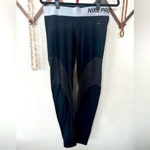 Black Nike Pro leggings with gold & silver striped detailing